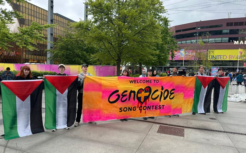 The banner at the centre of the protest march featured the Eurovision logo changed to read 'genocide'