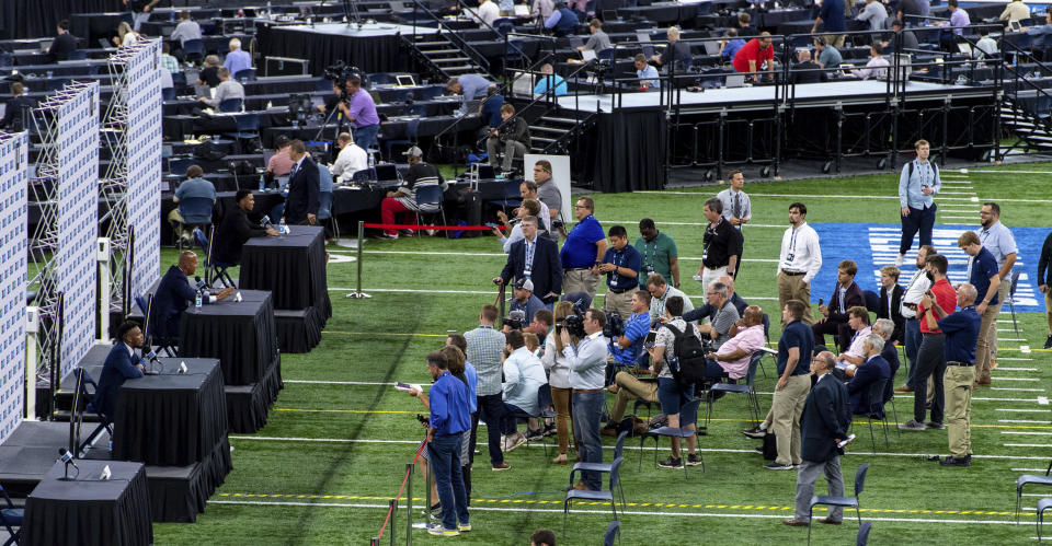 NCAA college football players and coaches take turns at a podiums to respond to reporter's questions at the Big Ten Conference media days, Thursday, July 22, 2021, at Lucas Oil Stadium in Indianapolis. (AP Photo/Doug McSchooler)