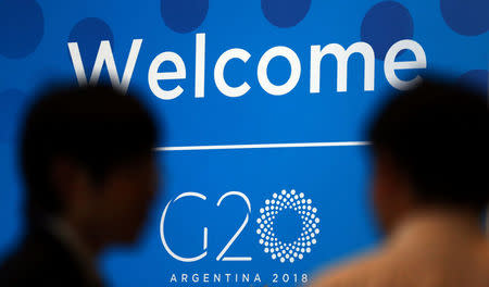 Two men talk at the G20 Meeting of Finance Ministers in Buenos Aires, Argentina, March 19, 2018. REUTERS/Marcos Brindicci