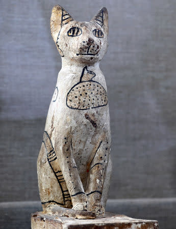 A cat statue that was discovered inside the tomb of Khufu-Imhat is displayed, at the Saqqara area near its necropolis, in Giza, Egypt November 10, 2018. REUTERS/Mohamed Abd El Ghany