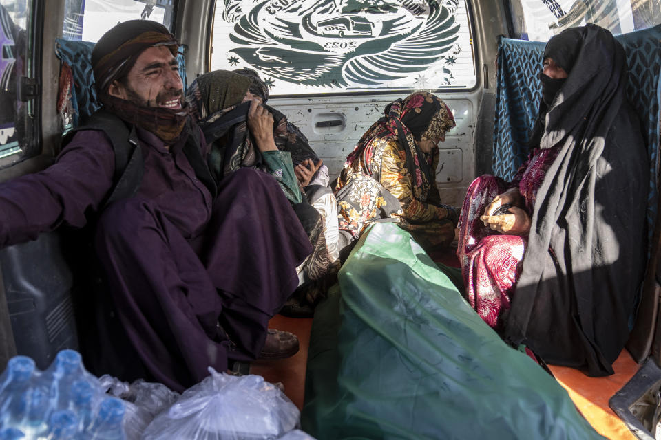 Afghan people mourn for relatives killed in an earthquake at a burial site in Zenda Jan district in Herat province, western of Afghanistan, Sunday, Oct. 8, 2023. Powerful earthquakes killed at least 2,000 people in western Afghanistan, a Taliban government spokesman said Sunday. It's one of the deadliest earthquakes to strike the country in two decades. (AP Photo/Ebrahim Noroozi)