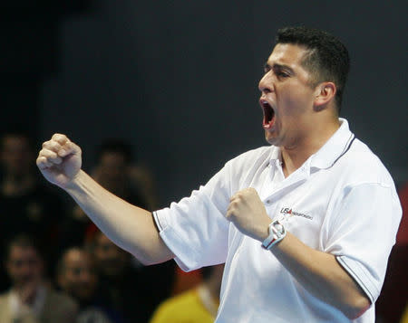 FILE PHOTO: Jean Lopez, brother and coach to U.S. taekwondo exponent Steven Lopez, celebrates after his brother won a gold medal at World Taekwondo Championships in Madrid, Spain April 15, 2005. REUTERS/Susana Vera/File Photo