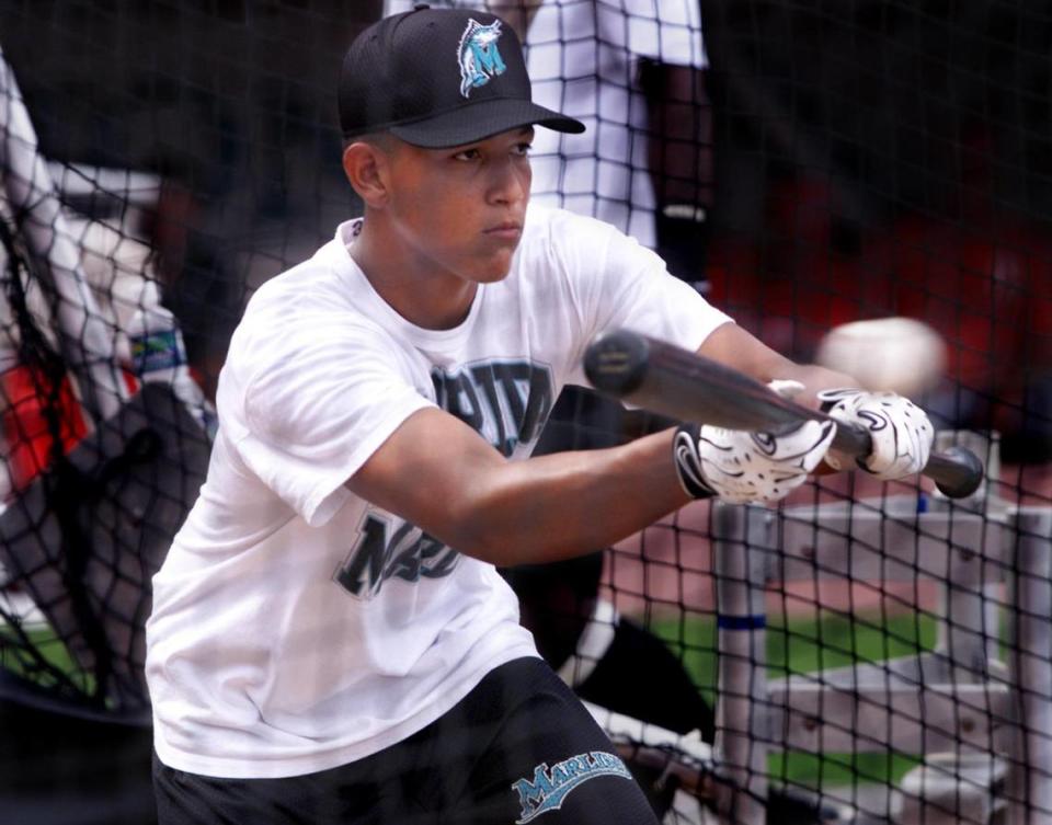 In this Aug. 4, 1999, file photo, a 16-year-old Miguel Cabrera takes batting practice at Pro Player Stadium ahead of a Florida Marlins game against the Philadelphia Phillies.