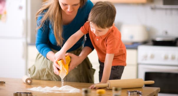 young mother and son in kitchen ...