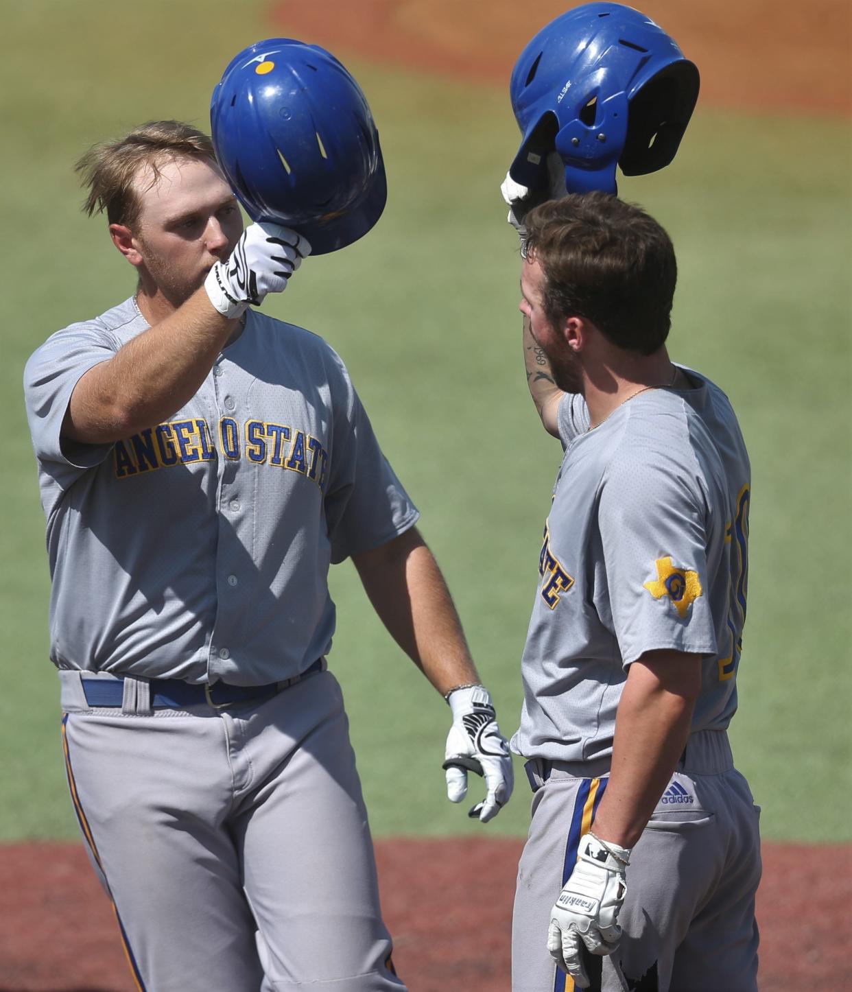 Angelo State University's Aaron Walters, left, celebrates with teammate Justin Lee after hitting a home run against Colorado Mesa during Game 2 of the Super Regional at Foster Field at 1st Community Credit Union Stadium on Saturday, May 28, 2022.