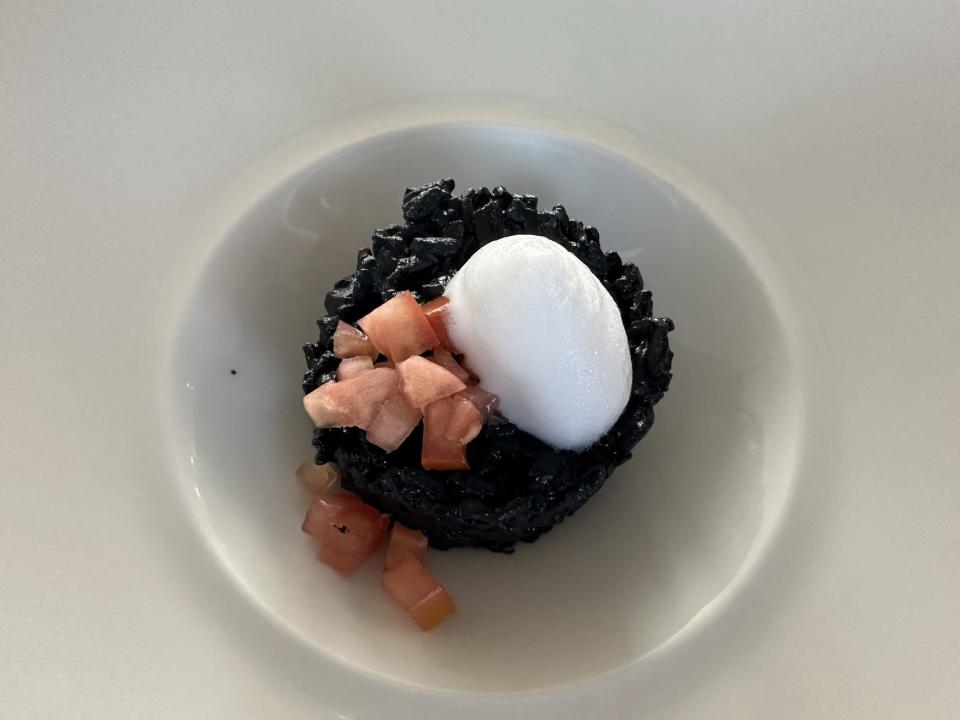 A TKTK risotto with squid ink served as a starter.