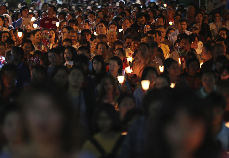 In this Friday, Oct. 18, 2019, photo, Catholic devotees hold candles during the 30th anniversary of the beatification of seven martyrs at Songkhon village in Mukdahan province , northeastern Thailand. In 1940, seven villagers here were executed for refusing to abandon their Catholic faith, which Thai nationalists had equated with loyalty to France, whose colonial army in neighboring Indochina had fought Thailand in a brief border war. The seven were beatified in 1989 by Pope John Paul II, the first step to being named a saint. (AP Photo/Sakchai Lalit)