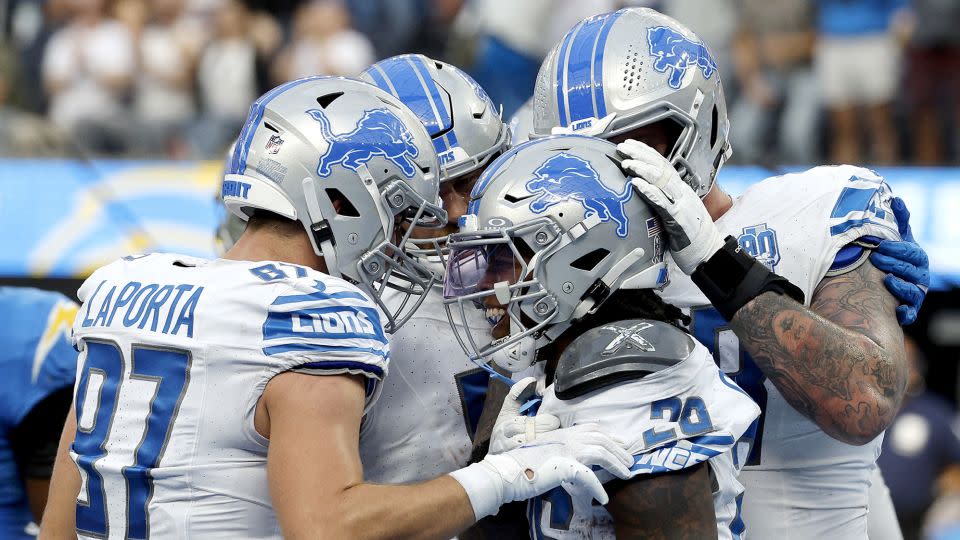 Jahmyr Gibbs celebrates a touchdown with his Lions teammates during the first half against the Los Angeles Chargers at SoFi Stadium on November 12, 2023. - Kevork Djansezian/Getty Images