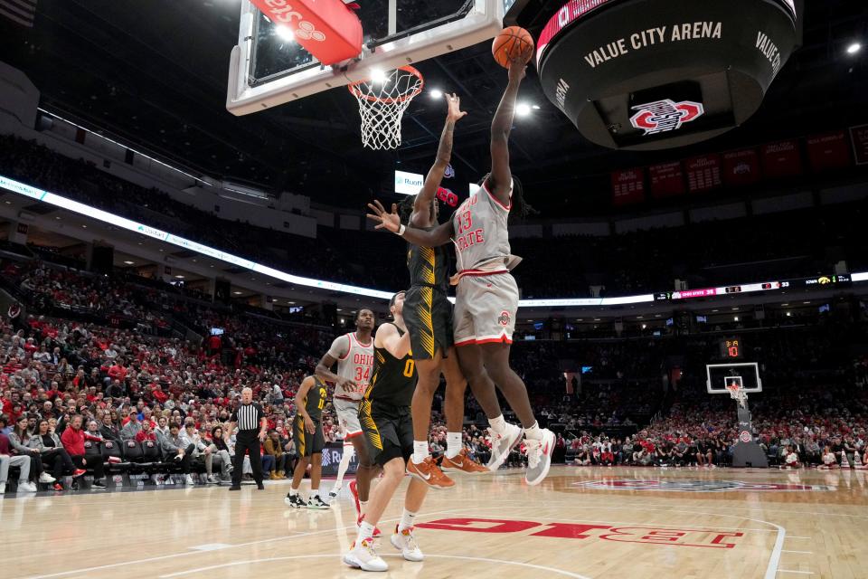 Ohio State's Isaac Likekele scores against Iowa.