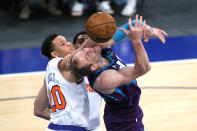 New York Knicks' Kevin Knox II, left, fouls Charlotte Hornets' Cody Zeller during the first half of an NBA basketball game Tuesday, April 20, 2021, in New York. (Sarah Stier/Pool Photo via AP)