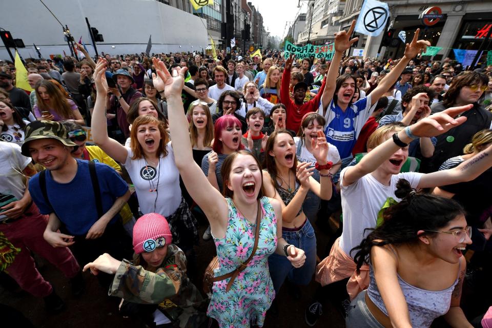 Extinction Rebellion protesters dancing and singing in Oxford Circus (Getty Images)