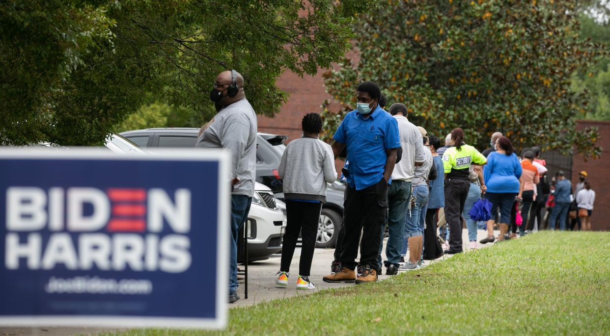 People stand in line on the first day of early voting for the general election at the C.T. Martin Natatorium and Recreation Center on Oct. 12, 2020, in Atlanta. Early voting in Georgia ran from Oct. 12-30. (Photo: Jessica McGowan via Getty Images)