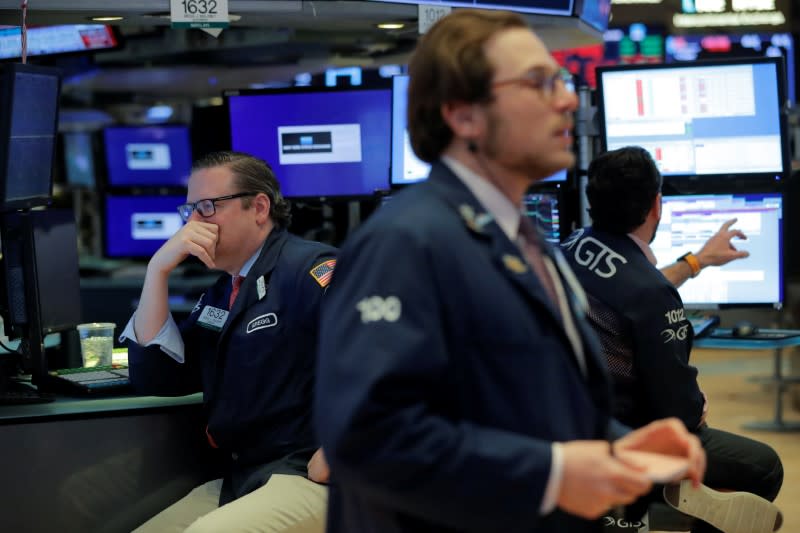 Traders work on the floor of the New York Stock Exchange (NYSE) in New York