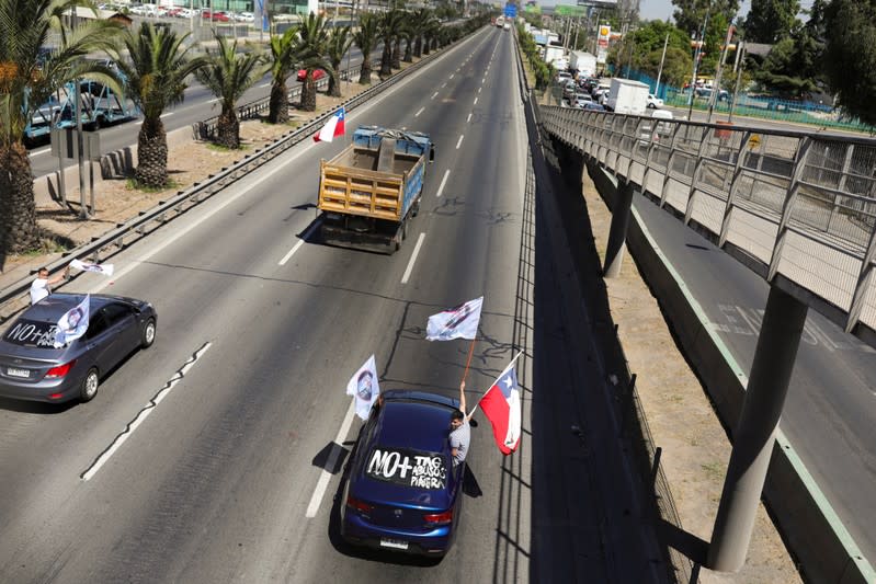 People block the road during a protest against the road tolls in the outskirts of Santiago