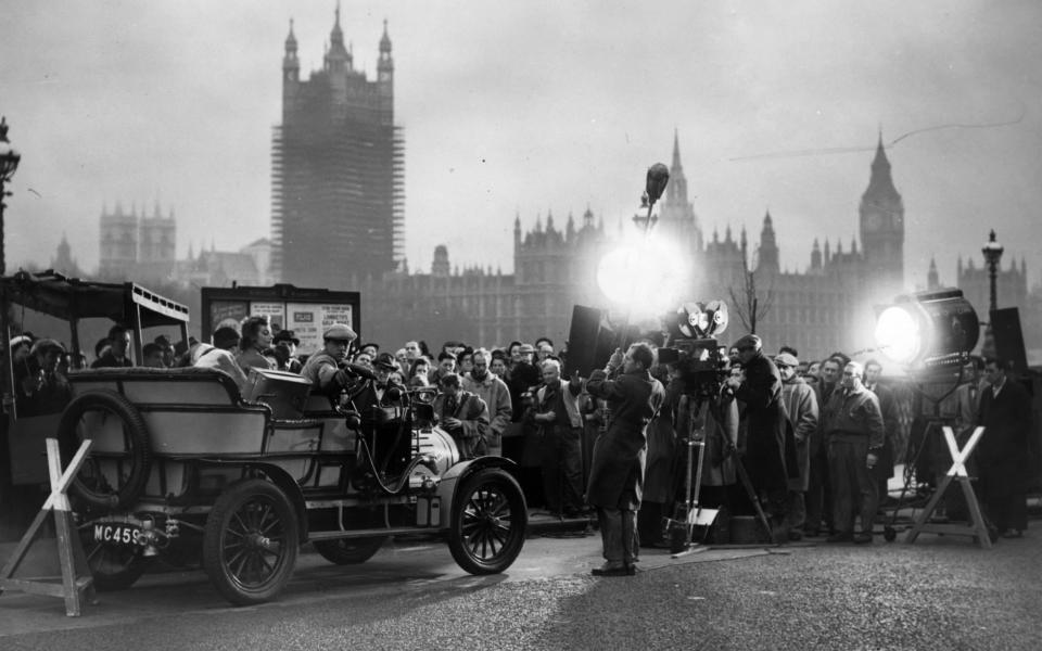 Units of the J Arthur Rank organisation filming on Lambeth Bridge for the film 'Genevieve'. - Edward Miller/Hulton Archive