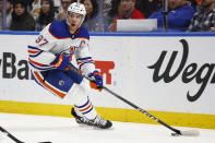 Edmonton Oilers center Connor McDavid (97) carries the puck during the second period of an NHL hockey game against the Buffalo Sabres, Monday, March 6, 2023, in Buffalo, N.Y. (AP Photo/Jeffrey T. Barnes)