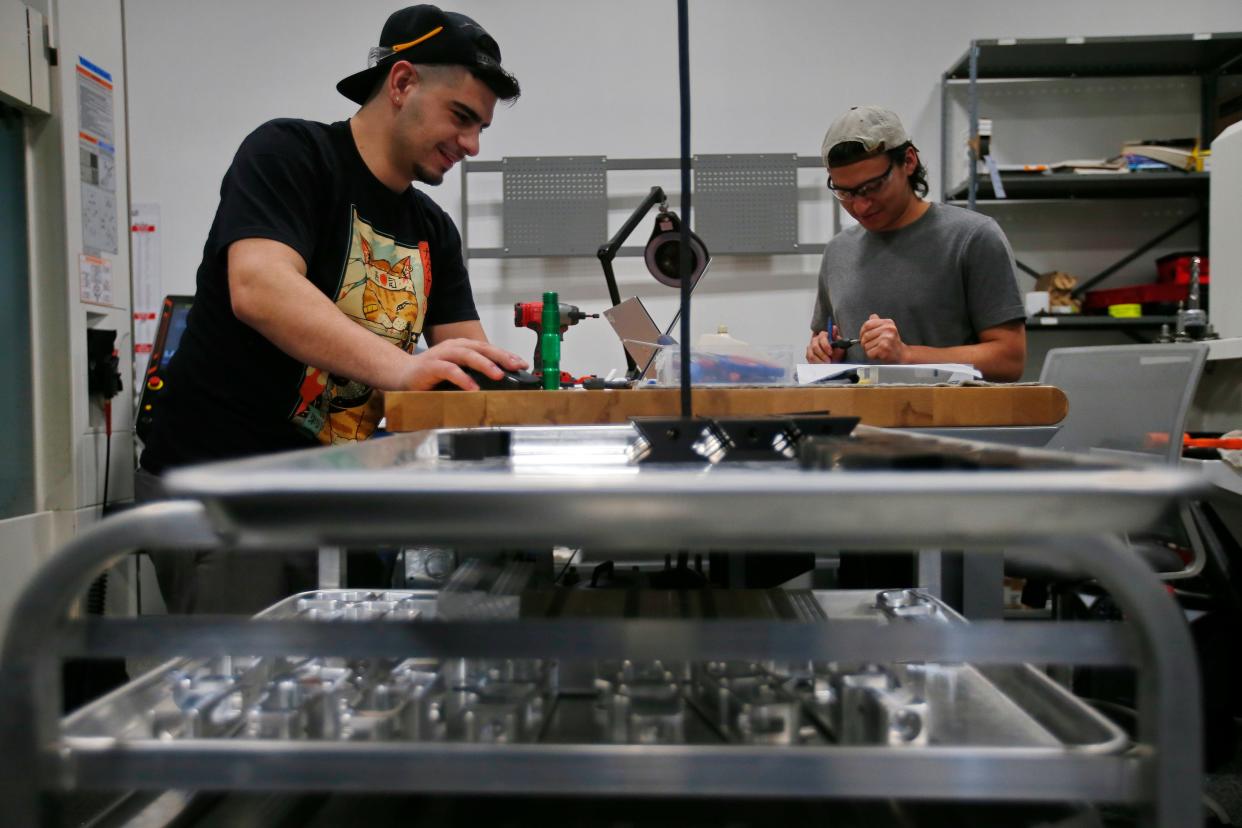Alex Chaves and Deyner Ruiz run some of the current manufacturing contracts at the new Proto XYZ manufacturing facilty on Potomska Street in New Bedford.