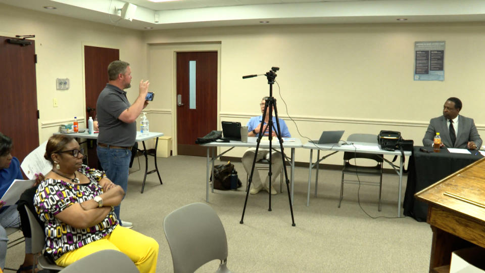 <em>Queen City News Chief Investigative Reporter Jody Barr questions Bennettsville City Attorney Mason King during an April 16, 2024, special called council meeting where city leaders tried to take a financial accounting problem behind closed doors. (WJZY Photo/Jody Barr)</em>