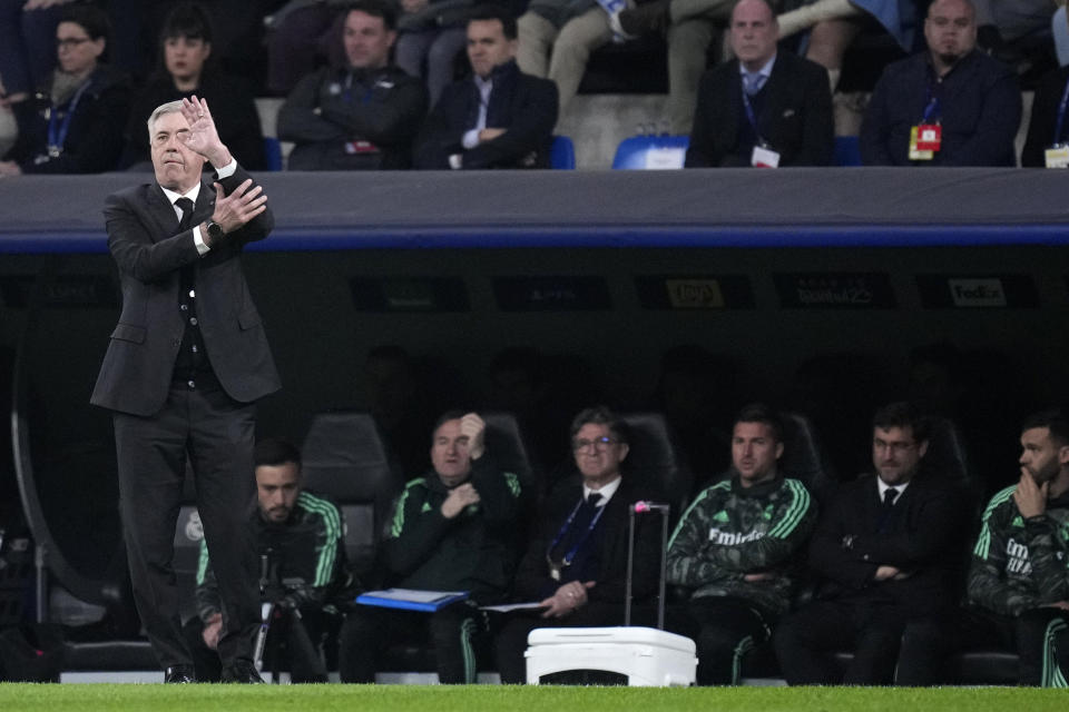 Real Madrid's head coach Carlo Ancelotti gestures during the Champions League, round of 16, second leg soccer match between Real Madrid and Liverpool at the Santiago Bernabeu stadium in Madrid, Spain, Wednesday, March 15, 2023. (AP Photo/Bernat Armangue)
