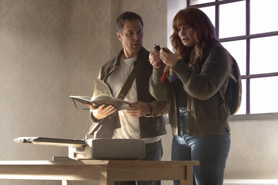 This image released by Apple shows Sam Rockwell, left, and Bryce Dallas Howard in a scene from "Argylle." (Peter Mountain/Apple-Universal Pictures via AP)