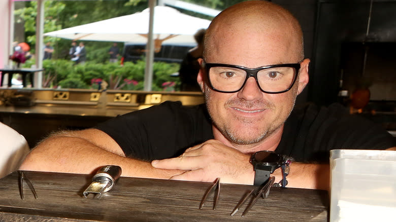 Heston Blumenthal leaning on a counter