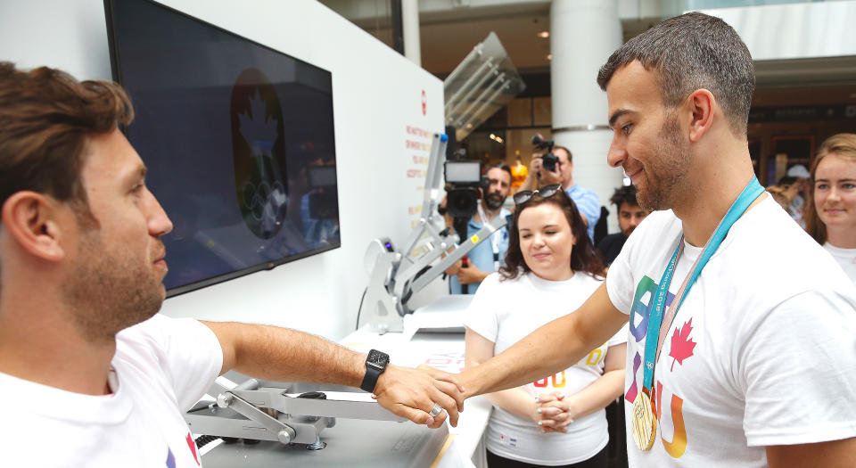 Olympic champion Eric Radford helps launch the Canadian Olympic Committee’s first ever ‘Be You’ pop up store in celebration of Pride 2018 on June 22, 2018 at CF Toronto Eaton Centre. (Photo: Adam Pulicicchio/COC)