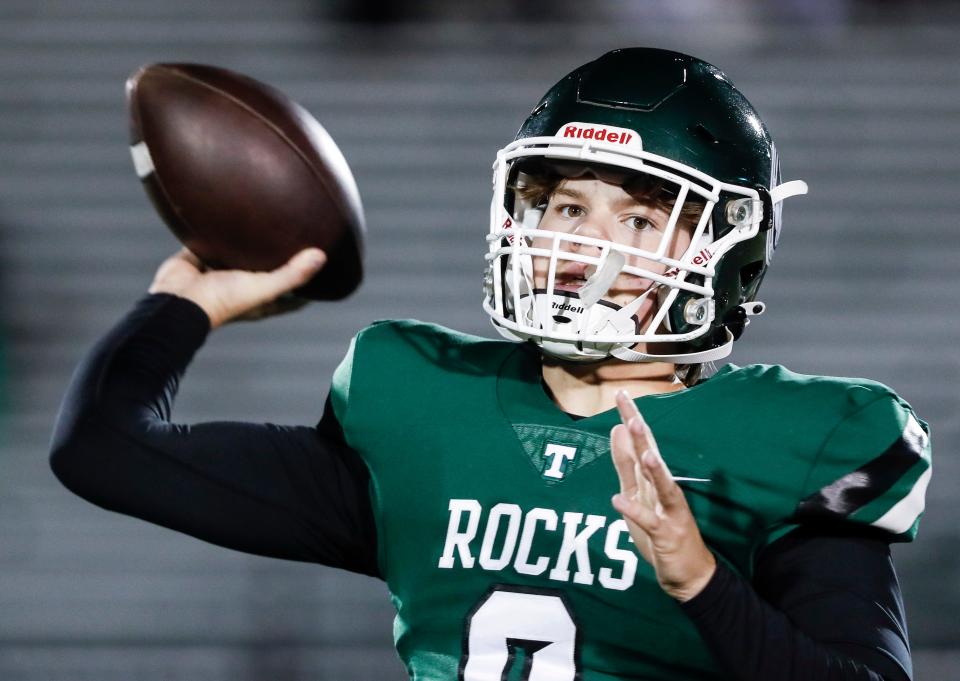 Trinity quarterback Zane Johnson warms up before the Rocks face Frederick Douglass in Friday's Class 6A state semifinal.  November 24, 2023.