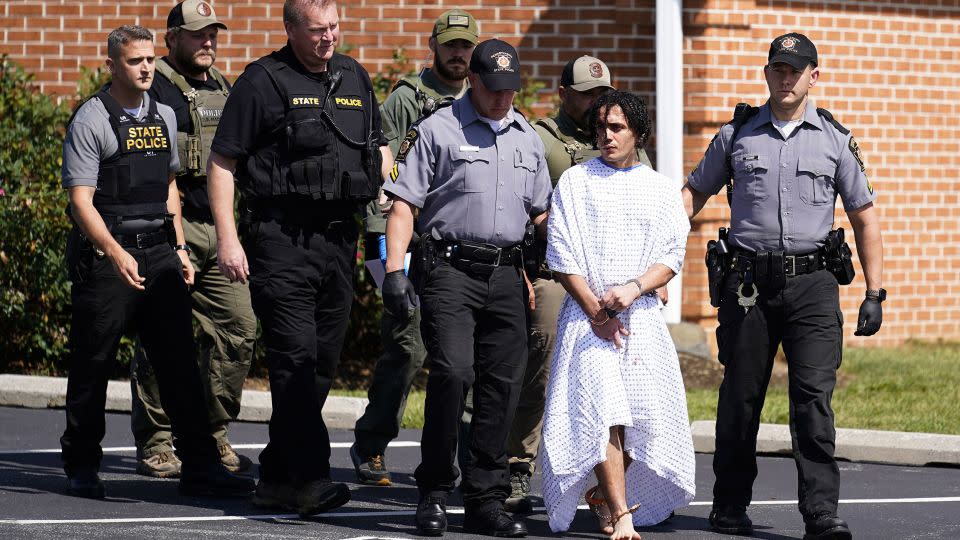 Law enforcement officers escorted Danilo Cavalcante from a Pennsylvania State Police barracks in Avondale, Pennsylvania, on Wednesday, September 13. - Matt Rourke/AP