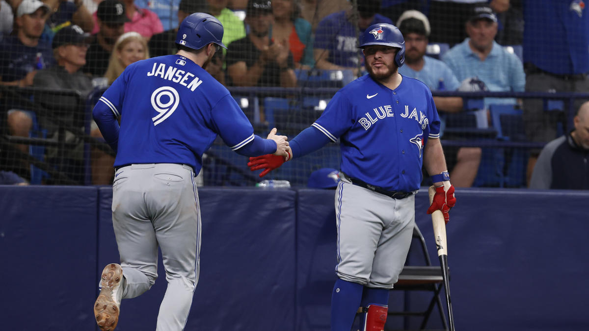 Tampa Bay Rays' pitcher Jason Adam, center, celebrates with teammates after  they defeated the Toronto Blue Jays in baseball game action in Toronto,  Ontario, Sunday, April 16, 2023. (Christopher Katsarov/The Canadian Press