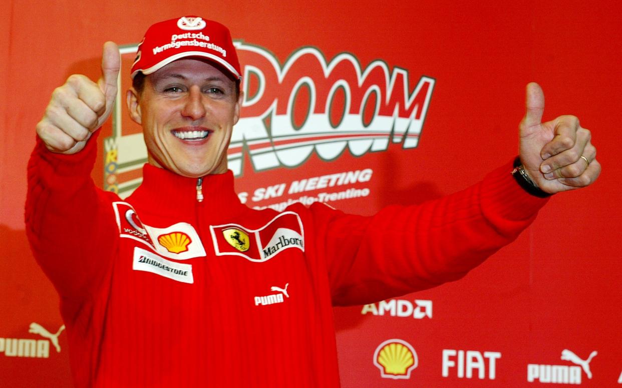 Ferrari driver Michael Schumacher of Germany gives a thumbs up sign at the end of a press conference in the Madonna di Campiglio ski resort, in the Italian Alps