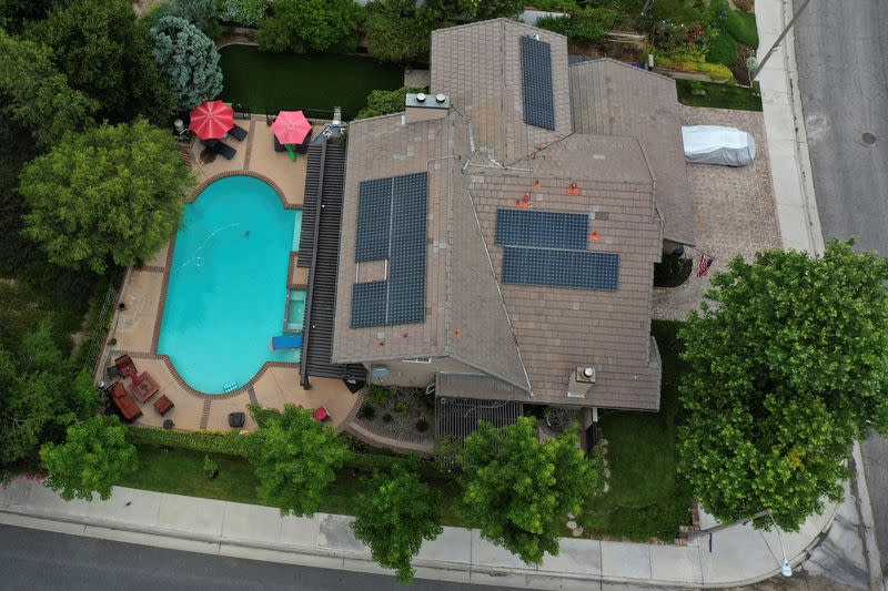 FILE PHOTO: Solar panels are seen on rooftops amid the coronavirus disease (COVID-19) outbreak, in Santa Clarita, near Los Angeles