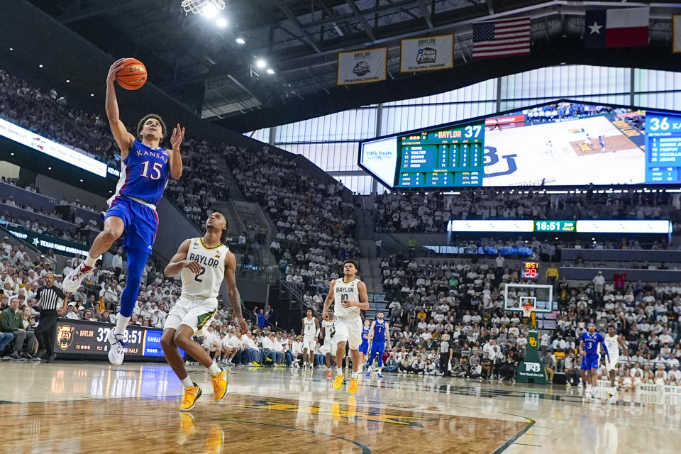Kansas's Kevin McCullar Jr. (15) goes up for a basket in front of Baylor's Jayden Nunn (2) on a breakaway following a Baylor turnover during the second half of an NCAA college basketball game, Saturday, March 2, 2024, in Waco, Texas. Baylor won 82-74. (AP Photo/Julio Cortez)
