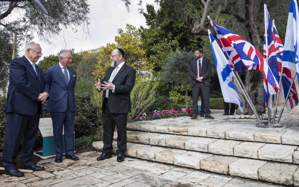 Prince Charles plants a tree in the grounds of the official residence of Israeli President Reuven Rivlin on January 23, 2020 