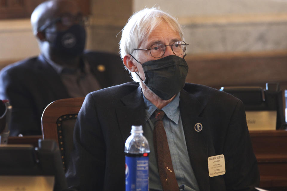 Kansas state Rep. Boog Highberger, D-Lawrence, follows a House debate over a Republican redistricting plan that moves his hometown into a central and western Kansas district, Tuesday, Jan. 25, 2022, at the Statehouse in Topeka, Kan. Highberger calls the proposal "a travesty," and others complain about putting the liberal Lawrence into a district with conservative rural communities hours away by car. (AP Photo/John Hanna)