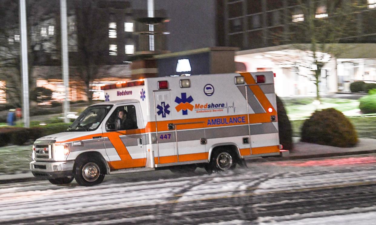 A Medshore ambulance drives by AnMed Health while a snow mix falls in Anderson Sunday, January 16, 2022. A winter storm mix blanketed the Upstate.