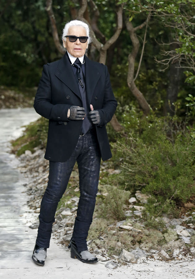 <b>Chanel SS13:</b> Karl Lagerfield, in his trademark black, hit the runway after the presentation.<br><br>© Reuters