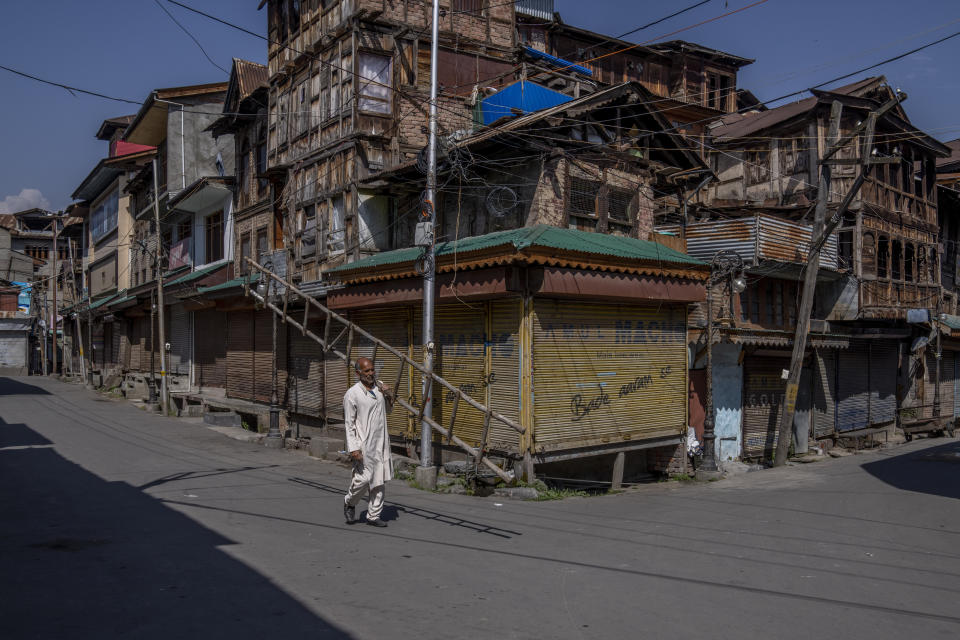 Kashmiri man carry a bamboo ladder as he walks past closed market during a strike against the remarks made by Nupur Sharma, a spokesperson of governing Hindu nationalist party about Prophet Mohammed, in Srinagar, Indian controlled Kashmir, Friday, June 10, 2022. In Indian-controlled Kashmir, authorities locked down two towns on Friday and snapped internet on mobile phones in several towns and in Srinagar, the disputed region’s main city, fearing anger against the insulting remarks to Islam could morph into larger, anti-India protests. (AP Photo/Dar Yasin)