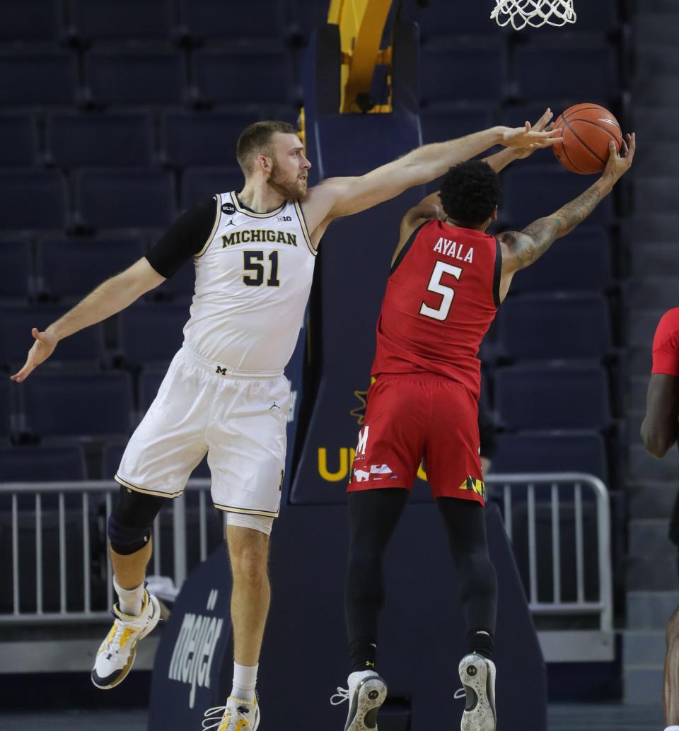 Michigan Wolverines forward Austin Davis defends Maryland Terrapins guard Eric Ayala during the second half Tuesday, Jan. 19, 2021.