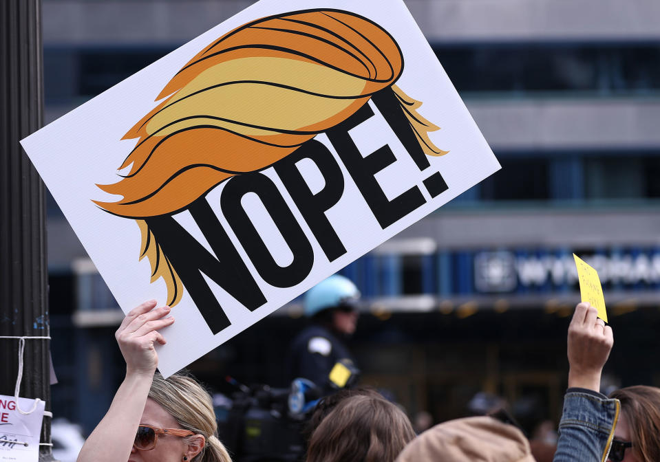 <p>Demonstrators hold placards as they stage a Presidents’ Day protest near Trump Tower on Feb. 20, 2017, in Chicago. The demonstration was one of many anti-Trump rallies held around the country on the federal holiday billed as “Not My President’s Day.” (Bilgin S. Sasmaz/Anadolu Agency/Getty Images) </p>