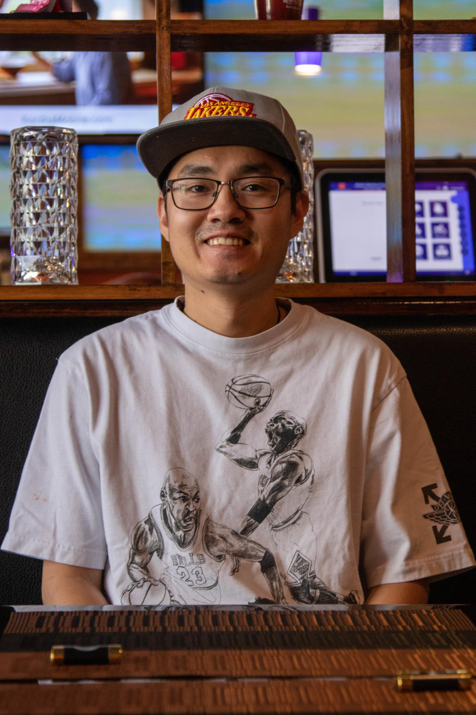 Cheng Pan, the owner of Kitami Yakiniku & Sushi on 731 Main St, in Lafayette, waits for customers to come in for lunch on a slow day, on June 2, 2022.