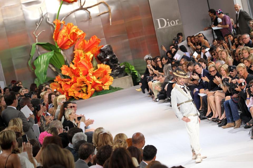 John Galliano walks the runway at the end of the Dior show as part of the Paris Haute Couture Fashion Week Fall/Winter 2011 event at Musee Rodin on 5 July 2010 (Getty)