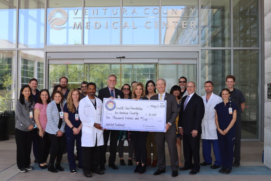 Ventura County District Attorney Erik Nasarenko awards a $10,000 check to staff at the Ventura County Medical Center. The money comes from cash seized during drug busts. (Ventura County District Attorney's Office)