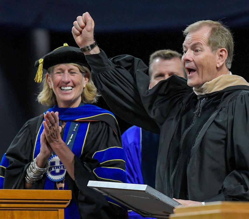 Elder Gary E. Stevenson of The Church of Jesus Christ of Latter-day Saints yells out “Go Aggies” after receiving an honorary degree of doctor of business during Utah State University’s commencement ceremony on Thursday, May 4, 2023, in Logan, Utah. | Eli Lucero, Herald Journal