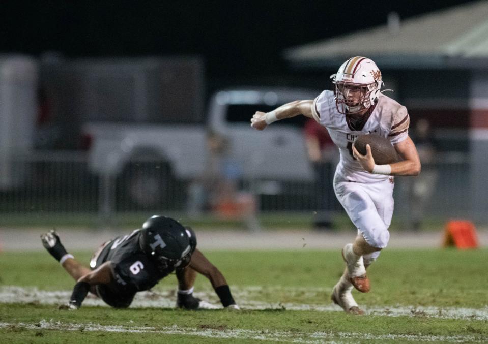Quarterback Wyatt Scruggs (17) slips past Nathan Shimek (6) before passing to Joe Wright (9) for a touchdown to cut the Aggies lead to 35-6 during the Northview vs Tate football game at Tate High School in Cantonment on Thursday, Sept. 7, 2023.