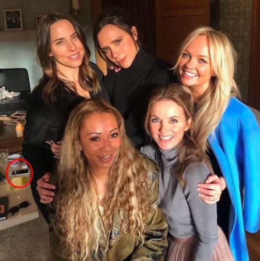 EVeryone's looking at the iPhone in the background of this shot. Photo: Instagram/Victoria Beckham