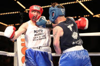 <p>Sal Tramontana takes one in the jaw from opponent Nick Salvador during the NYPD Boxing Championships at the Theater at Madison Square Garden on June 8, 2017. (Photo: Gordon Donovan/Yahoo News) </p>