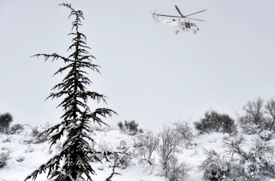 A helicopter surrounds the scene (Picture: Reuters)