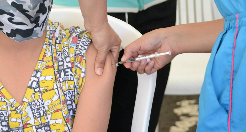 A person gets a dose of the Pfizer BioNTech COVID-19 Vaccine as teenagers above the age of 12 get vaccinated against the novel COVID-19 disease with the Pfizer BioNTech and AstraZeneca Coronavirus vaccines, in Bogota, Colombia on October 19, 2021. Colombia aims to ease face mask use after 75% of the population are fully vaccinated. Photo by Martin Galindo/Long Visual Press/ABACAPRESS.COM.