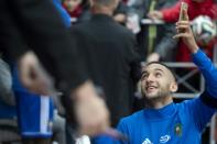 Morocco midfielder Hakim Ziyech is greeted by fans in Voronezh, Russia