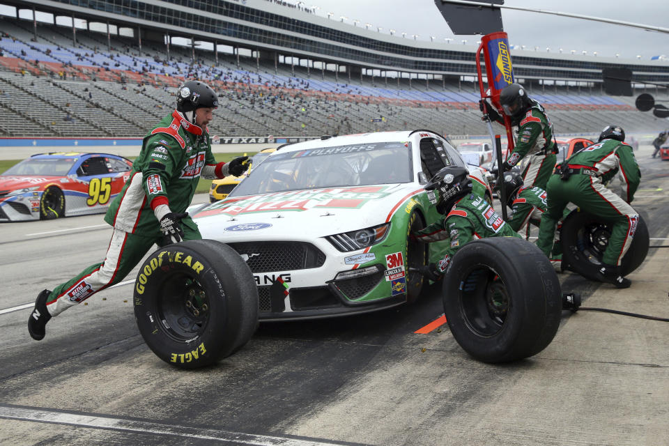 Kevin Harvick pits during the NASCAR Cup Series auto race at Texas Motor Speedway in Fort Worth, Texas, Wednesday, Oct. 28, 2020. (AP Photo/Richard W. Rodriguez)